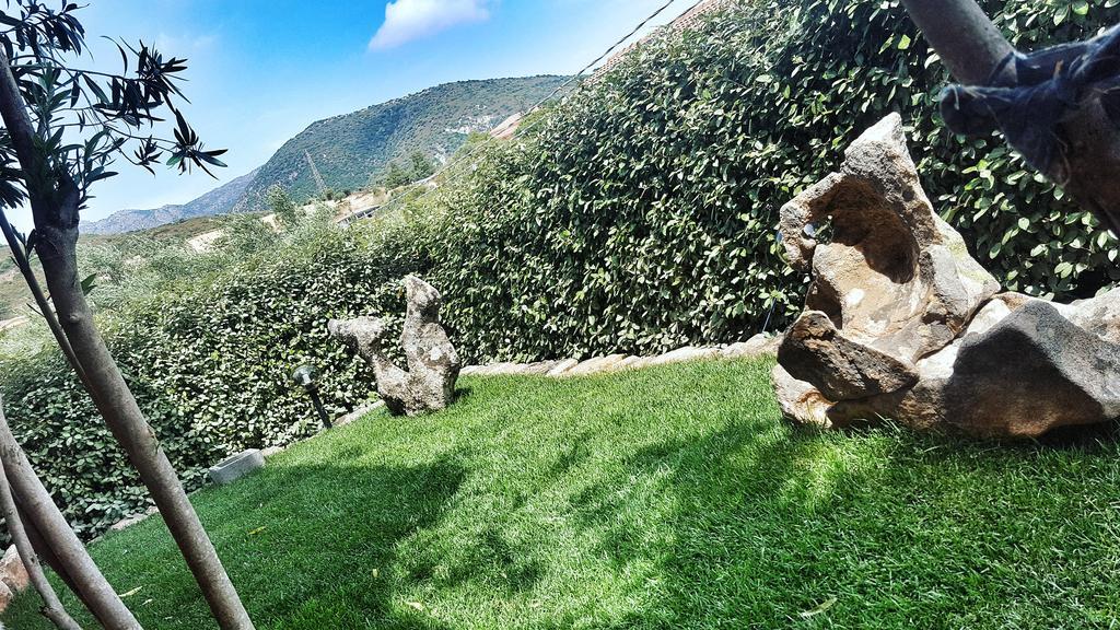 Camera Tripla con Vista Giardino